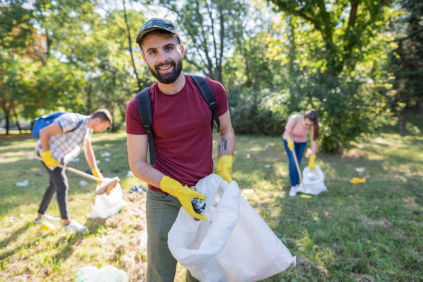 Inspiring Ways Communities Are Turning Plastic Waste into Art students doing charity work in the local park
